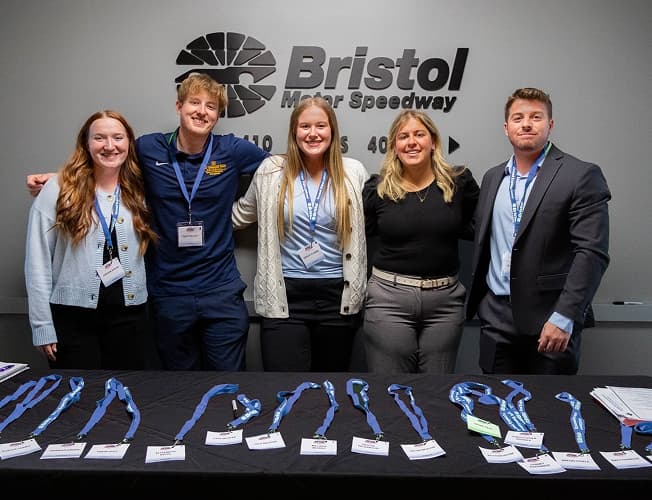 ETSU students and staff posing at a Bristol Motor Speedway event