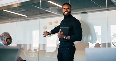Male business professional smiling turn around