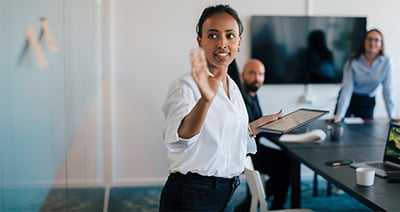 Young woman raising hand